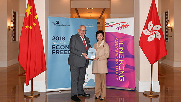 The Chief Executive, Mrs Carrie Lam (right), receives a copy of the Heritage Foundation's 2018 Index of Economic Freedom Report from its Founder, Dr Edwin Feulner, at Government House on January 31.