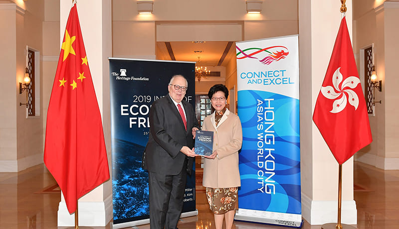 The Chief Executive, Mrs Carrie Lam (right), meets with the Founder of the Heritage Foundation, Dr Edwin Feulner, at Government House and receives from him a copy of the recently published 2019 Index of Economic Freedom Report.