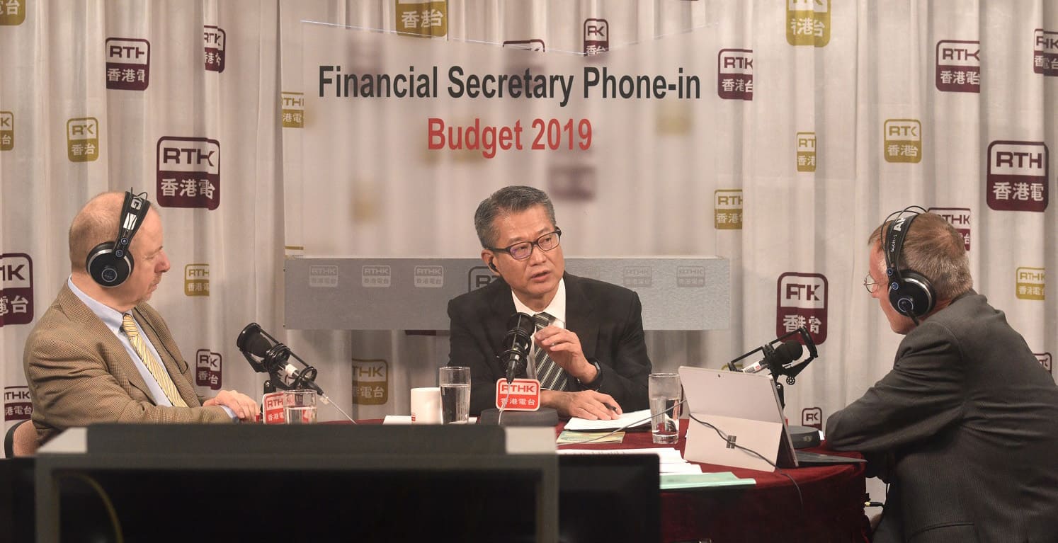 The Financial Secretary, Mr Paul Chan (centre), attends the Radio Television Hong Kong Radio 3 programme "Financial Secretary Phone-in" on March 1 to answer questions from the public on the 2019-20 Budget.